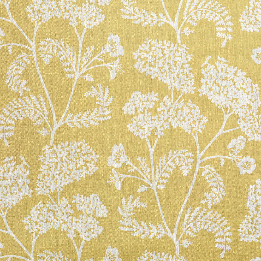 linen fabric showing grey wild flowers against yellow, hand blocked by Madder and Cutch