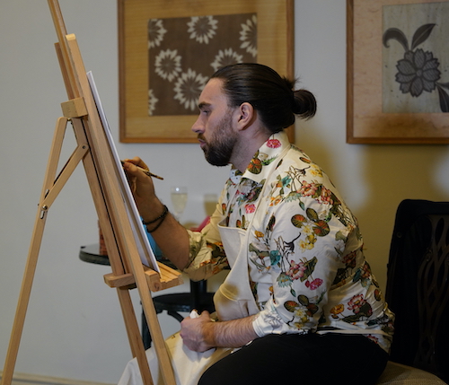 Brad kenny, portrait painter, at work using sustainable plant-based paints.